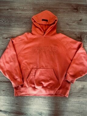 Fear of God Essentials Hoodie in Coral